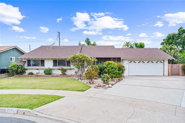 1305 S Westchester Dr, Anaheim, CA 92804 - single story home featuring an attached garage, stucco siding, driveway, a front lawn, and a shingled roof