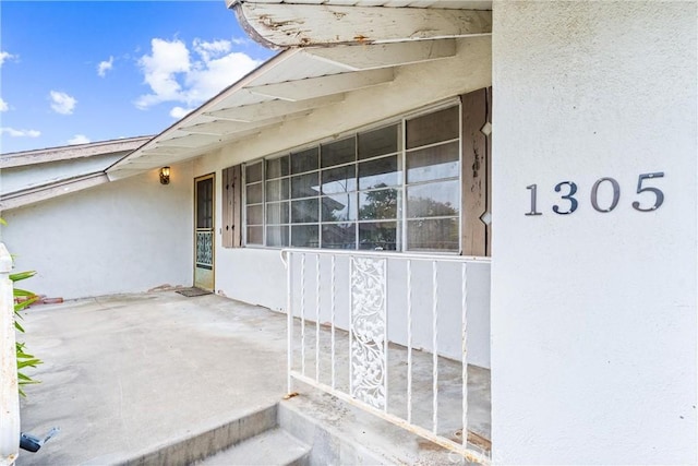 1305 S Westchester Dr, Anaheim, CA 92804 - doorway to property featuring stucco siding