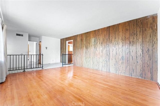 1305 S Westchester Dr, Anaheim, CA 92804 - spare room with wood walls and wood finished floors
