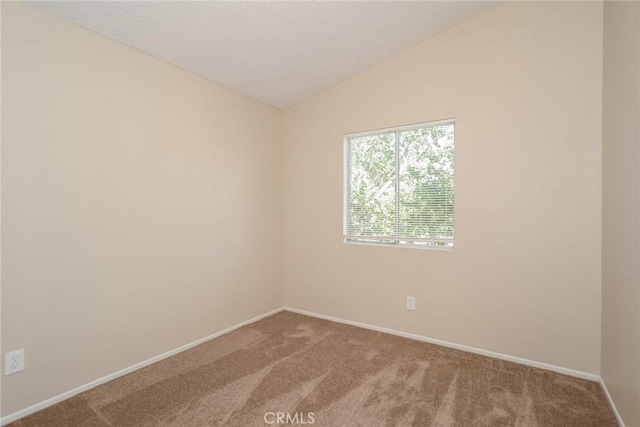 44930 11th St E, Lancaster, CA 93535 - carpeted empty room featuring vaulted ceiling and a textured ceiling