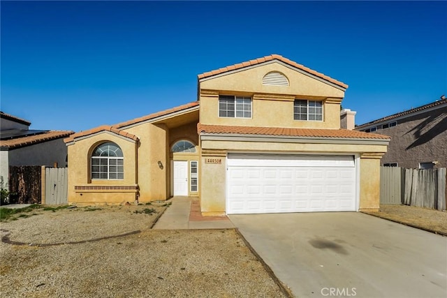 44930 11th St E, Lancaster, CA 93535 - view of front of property featuring a tiled roof, concrete driveway, stucco siding, and a garage