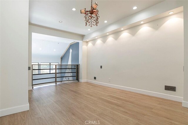 13331 Moorpark St Unit 319, Sherman Oaks, CA 91423 - unfurnished room featuring light wood finished floors, recessed lighting, and a chandelier