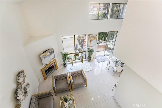 13331 Moorpark St Unit 319, Sherman Oaks, CA 91423 - tiled living area featuring a towering ceiling and a fireplace