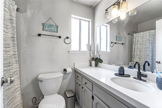 4883 E Geary St, Fresno, CA 93725 - full bath featuring plenty of natural light, vanity, and a shower with curtain