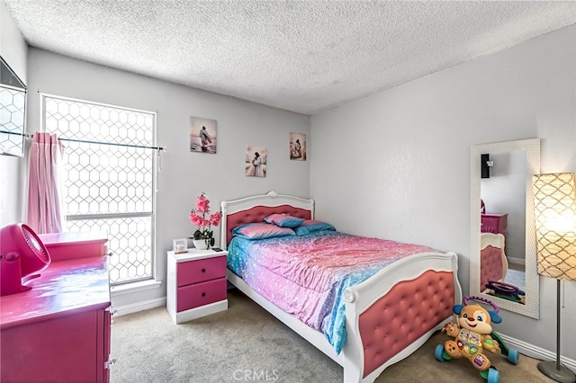 4883 E Geary St, Fresno, CA 93725 - carpeted bedroom with a textured ceiling and baseboards