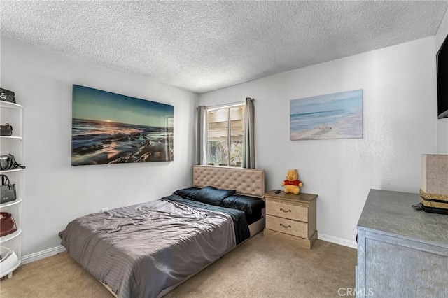 4883 E Geary St, Fresno, CA 93725 - bedroom featuring carpet and a textured ceiling
