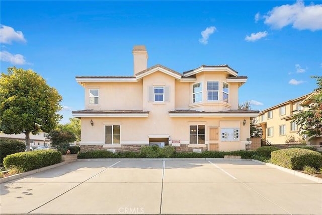 800 W Huntington Dr Unit D, Arcadia, CA 91007 - view of front of property with a chimney, stucco siding, and stone siding