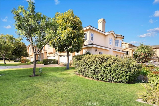 800 W Huntington Dr Unit D, Arcadia, CA 91007 - view of front of house with a front lawn, a chimney, and stucco siding