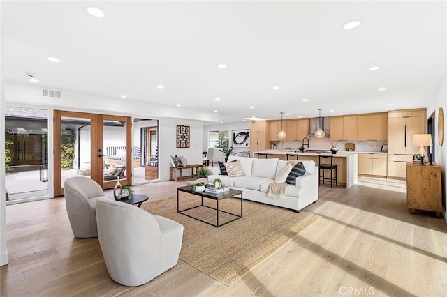 23912 Hillhurst Dr, Laguna Niguel, CA 92677 - living area with recessed lighting, light wood-style flooring, and french doors