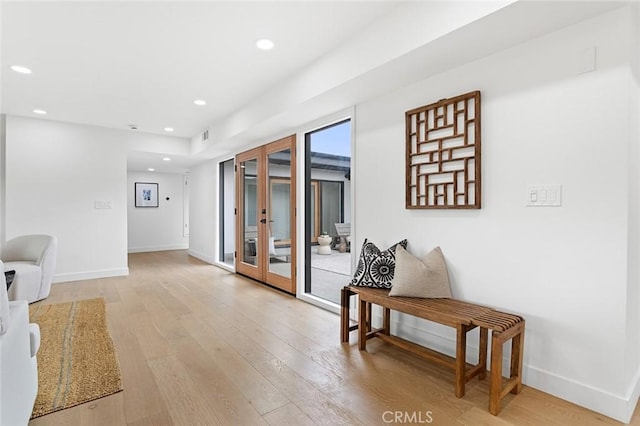 23912 Hillhurst Dr, Laguna Niguel, CA 92677 - hall with french doors, light wood finished floors, and recessed lighting
