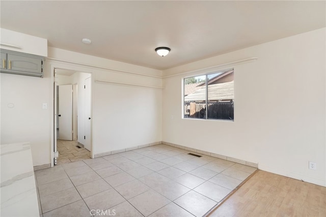 2738 S Fairway Ct, Visalia, CA 93277 - unfurnished room with baseboards and a smoke detector