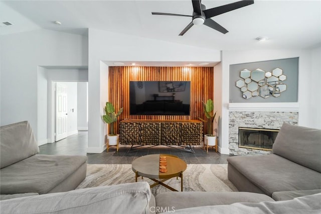 47645 Calle Diamante, Indio, CA 92201 - living room featuring vaulted ceiling, a ceiling fan, and a glass covered fireplace
