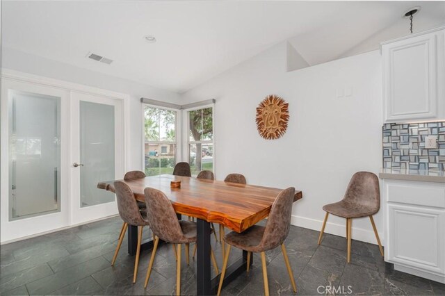 47645 Calle Diamante, Indio, CA 92201 - dining room with lofted ceiling, french doors, and stone tile floors