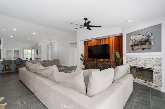 47645 Calle Diamante, Indio, CA 92201 - living room featuring ceiling fan, recessed lighting, lofted ceiling, and a stone fireplace