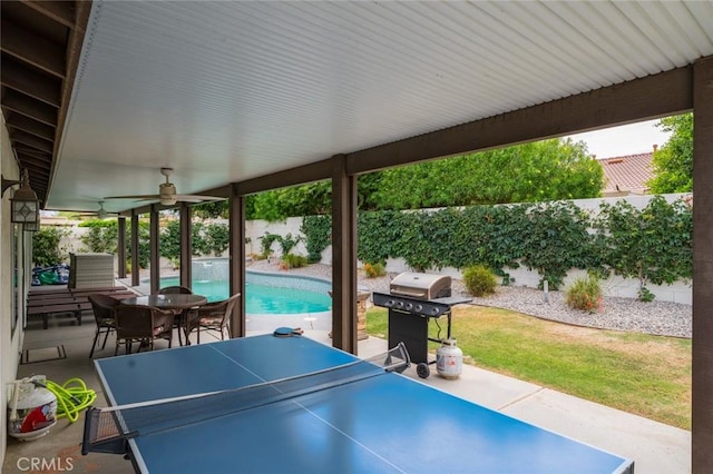 47645 Calle Diamante, Indio, CA 92201 - fenced backyard featuring grilling area, ceiling fan, a patio, and outdoor dining area