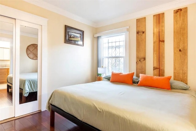 5162 S Manhattan Pl, Los Angeles, CA 90062 - bedroom with crown molding and dark wood-style floors