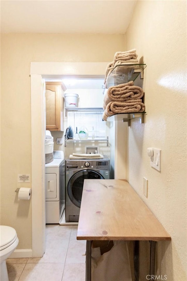5162 S Manhattan Pl, Los Angeles, CA 90062 - laundry room featuring separate washer and dryer and light tile patterned floors