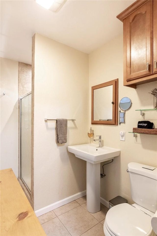 5162 S Manhattan Pl, Los Angeles, CA 90062 - bathroom featuring tile patterned floors and a stall shower