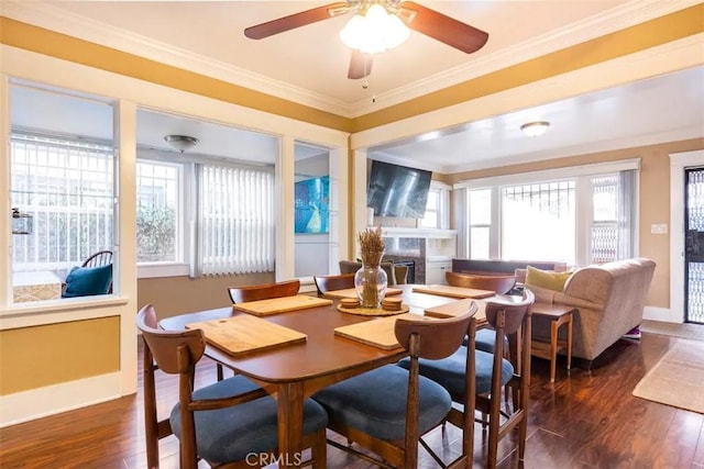 5162 S Manhattan Pl, Los Angeles, CA 90062 - dining space with plenty of natural light, wood finished floors, ceiling fan, and crown molding