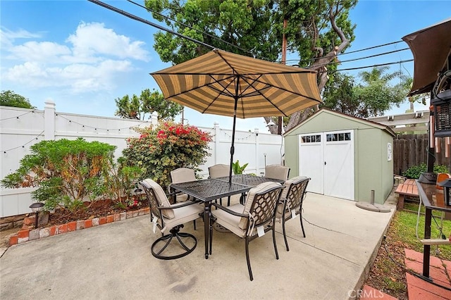 4303 E De Ora Way, Long Beach, CA 90815 - fenced backyard featuring outdoor dining space, a storage unit, and a patio area