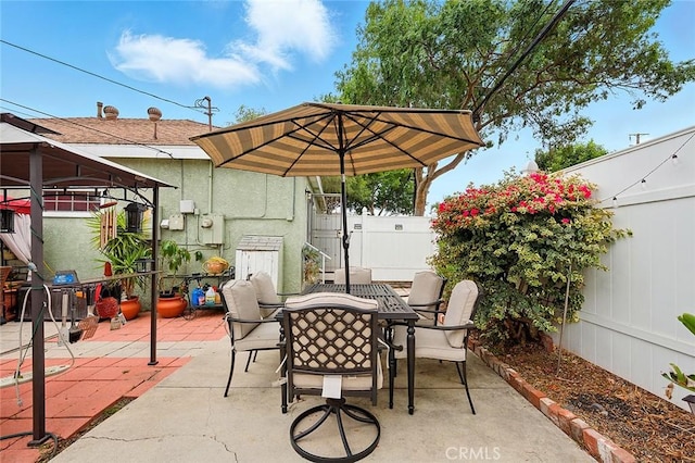 4303 E De Ora Way, Long Beach, CA 90815 - fenced backyard featuring a gazebo, outdoor dining space, and a patio area