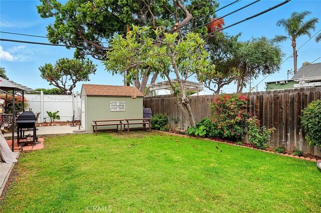 4303 E De Ora Way, Long Beach, CA 90815 - fenced backyard with a patio area and a storage unit