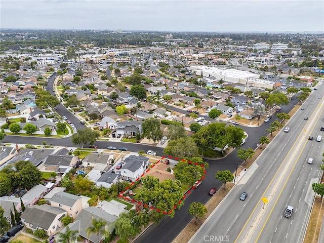 4303 E De Ora Way, Long Beach, CA 90815 - aerial perspective of suburban area featuring a major roadway and property boundaries highlighted