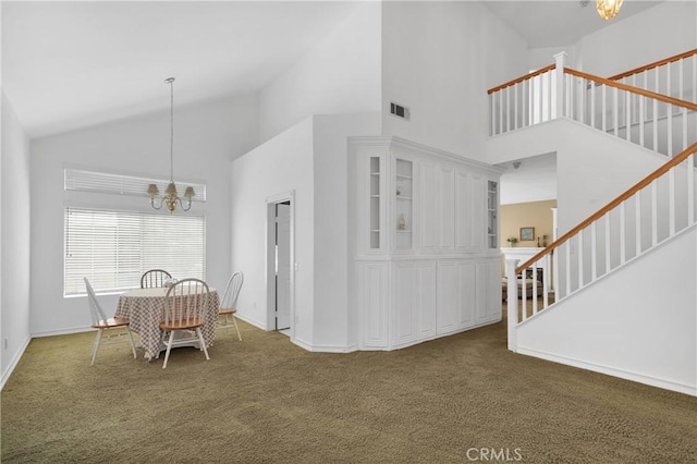 15030 Camino Arroyo, Chino Hills, CA 91709 - carpeted dining space featuring a chandelier, high vaulted ceiling, and stairs