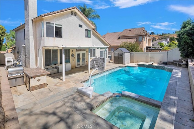 15030 Camino Arroyo, Chino Hills, CA 91709 - view of pool featuring french doors, a storage unit, a fenced backyard, a patio area, and a pool with connected hot tub