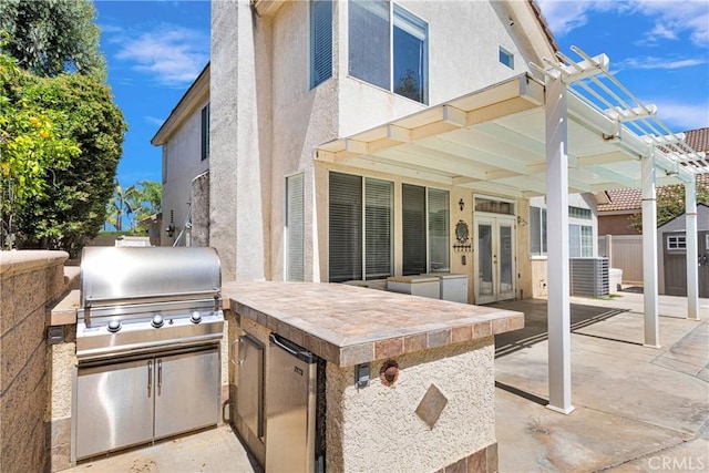 15030 Camino Arroyo, Chino Hills, CA 91709 - view of patio / terrace with french doors, exterior kitchen, a pergola, and a shed