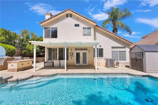 15030 Camino Arroyo, Chino Hills, CA 91709 - view of swimming pool featuring an outdoor kitchen, french doors, a shed, and a patio