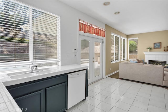15030 Camino Arroyo, Chino Hills, CA 91709 - kitchen featuring tile counters, white dishwasher, french doors, a fireplace, and open floor plan