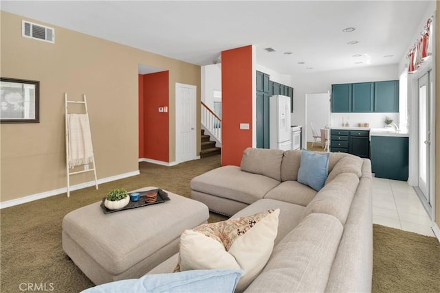 15030 Camino Arroyo, Chino Hills, CA 91709 - living room featuring light carpet and stairs