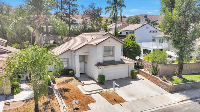15030 Camino Arroyo, Chino Hills, CA 91709 - view of front of home with an attached garage, driveway, stucco siding, a tiled roof, and a residential view