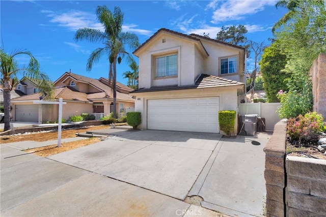 15030 Camino Arroyo, Chino Hills, CA 91709 - traditional home with stucco siding, an attached garage, concrete driveway, and a tiled roof
