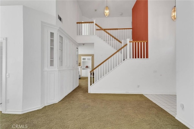 15030 Camino Arroyo, Chino Hills, CA 91709 - entrance foyer with carpet floors, a high ceiling, and stairway