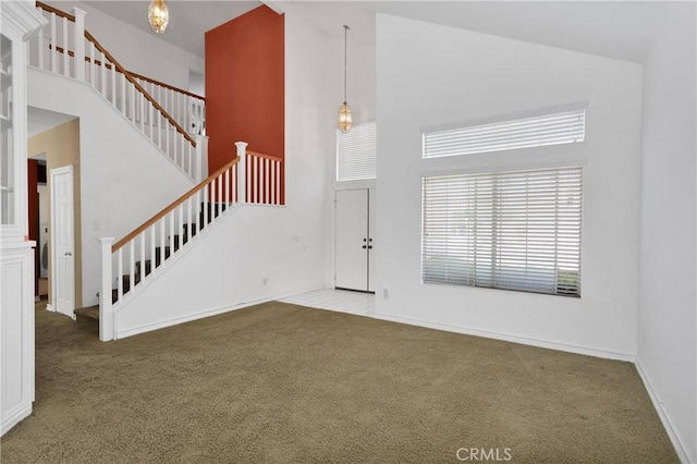 15030 Camino Arroyo, Chino Hills, CA 91709 - foyer entrance featuring high vaulted ceiling, carpet flooring, and stairs