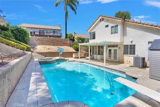 15030 Camino Arroyo, Chino Hills, CA 91709 - view of pool with french doors, a patio area, a pool with connected hot tub, and a diving board
