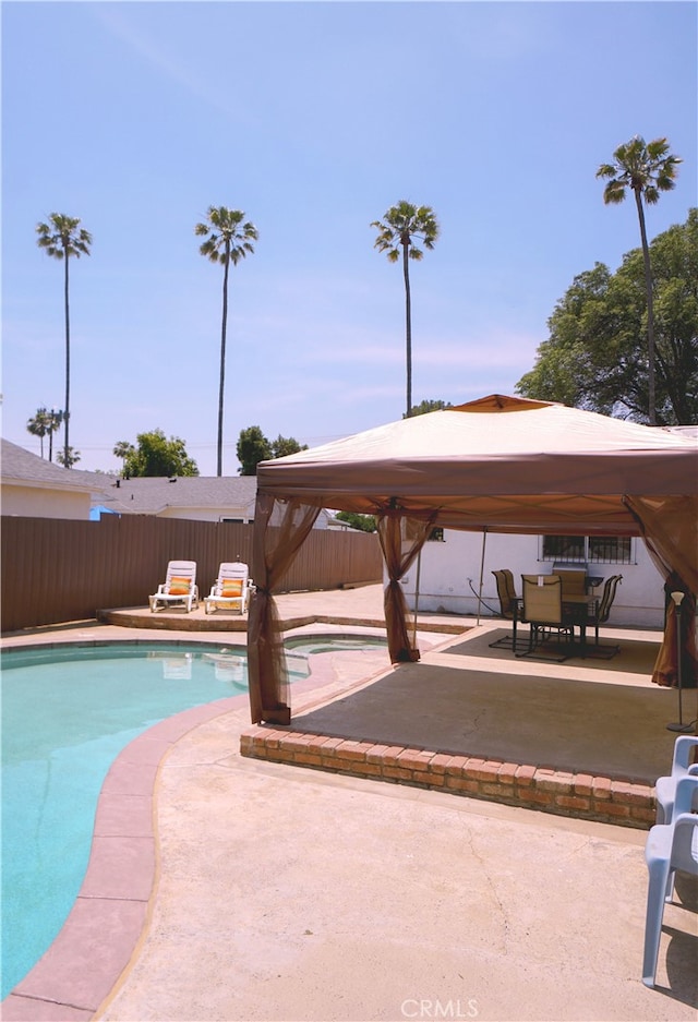 8937 Palmetto Ave, Fontana, CA 92335 - view of swimming pool featuring a gazebo, a fenced backyard, and a patio