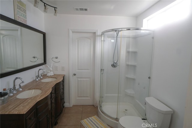 8937 Palmetto Ave, Fontana, CA 92335 - bathroom featuring a stall shower, double vanity, and tile patterned floors