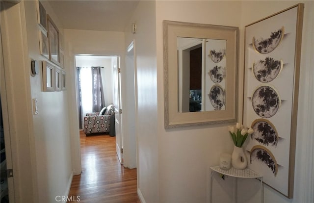 8937 Palmetto Ave, Fontana, CA 92335 - hallway featuring wood finished floors and baseboards