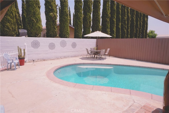8937 Palmetto Ave, Fontana, CA 92335 - view of swimming pool with a patio area, a fenced backyard, and outdoor dining area