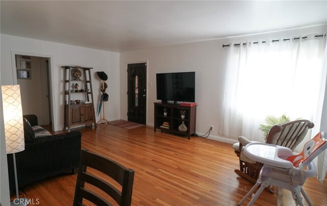 8937 Palmetto Ave, Fontana, CA 92335 - living room featuring light wood-style flooring