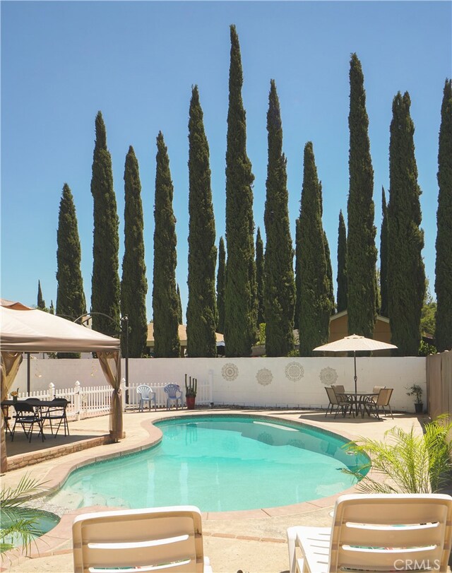 8937 Palmetto Ave, Fontana, CA 92335 - view of swimming pool with a fenced backyard, a patio, and a gazebo