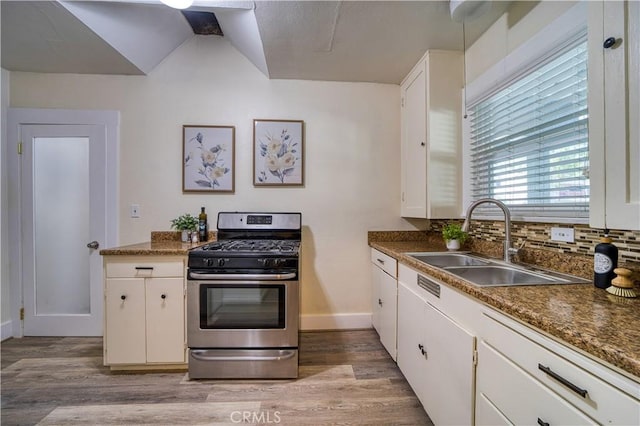 755 Chorro St, San Luis Obispo, CA 93401 - kitchen featuring gas range, light wood-style floors, white cabinetry, and dark countertops