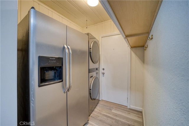 755 Chorro St, San Luis Obispo, CA 93401 - laundry area featuring stacked washer / drying machine, light wood-type flooring, and a textured wall