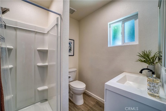755 Chorro St, San Luis Obispo, CA 93401 - full bathroom featuring vanity, wood finished floors, a stall shower, and a textured wall