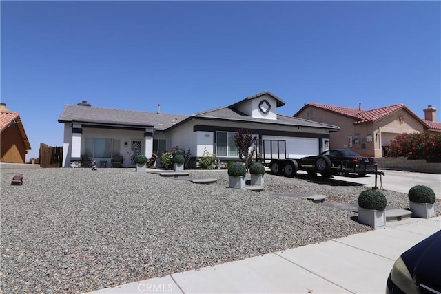 13115 Sunset Canyon Way, Victorville, CA 92395 - ranch-style home with an attached garage and stucco siding