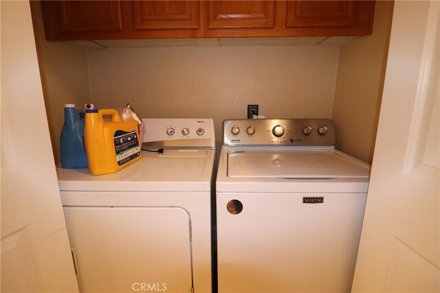 13115 Sunset Canyon Way, Victorville, CA 92395 - laundry room featuring washer and clothes dryer and cabinet space