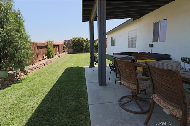 13115 Sunset Canyon Way, Victorville, CA 92395 - fenced backyard featuring a patio and outdoor dining area